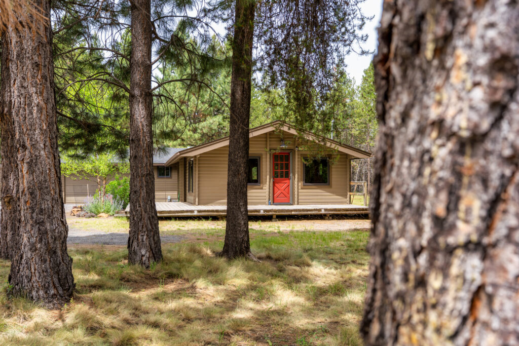 Rustic lodge great room with stone fireplace — real estate photography by Pro Property Photos by Wasim, Bend, Oregon.