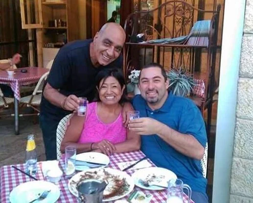 Sharing a drink and falafel sandwiches with the author and her husband “back home” in Nazareth.
